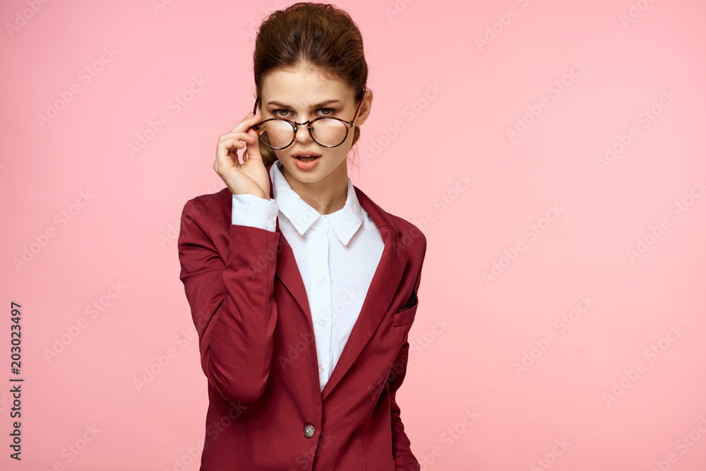 business woman with glasses on a pink background business woman with glasses on a pink background