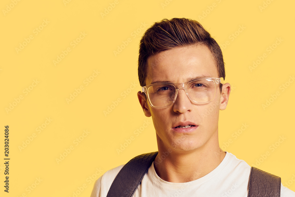 serious man with glasses on yellow background... serious man with glasses on yellow background...