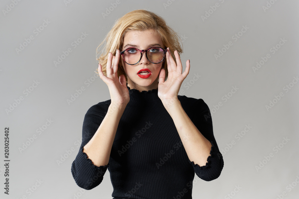 a woman with glasses is serious a woman with glasses is serious
