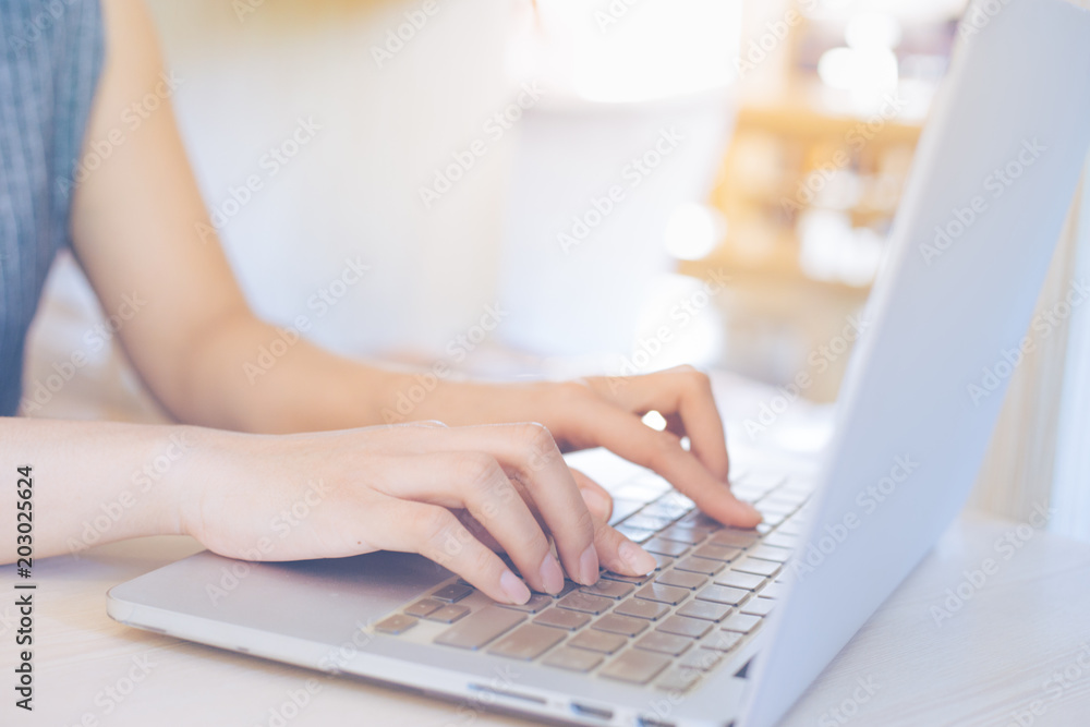 Business woman hand working with a laptop computer in the office. Business woman hand working with a laptop computer in the office.