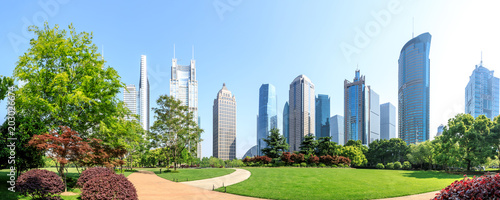 city park with modern commercial building background in shanghai