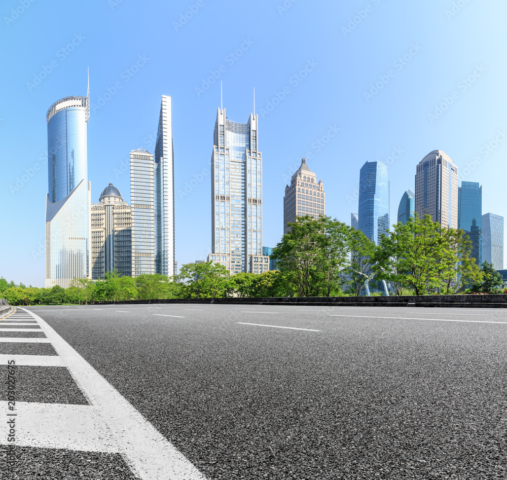 empty asphalt road with city skyline background in shanghai,China