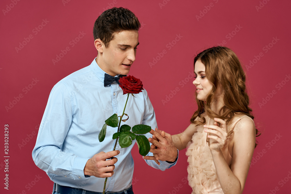 man gives a woman a holiday rose man gives a woman a holiday rose