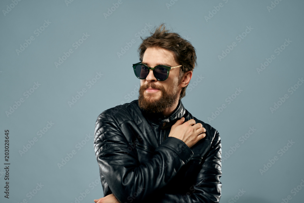 stylish man with glasses on a blue background stylish man with glasses on a blue background