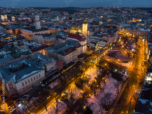 aerial view of city in night time. streets in car lights.