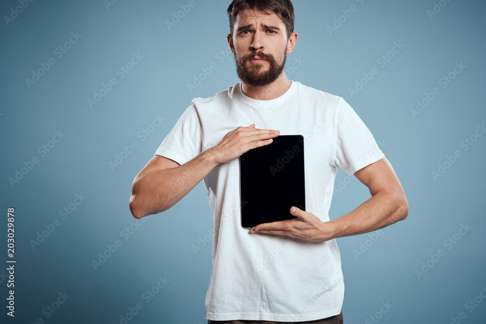 tablet in the hands of a man, ultrathin tablet in the hands of a man, ultrathin