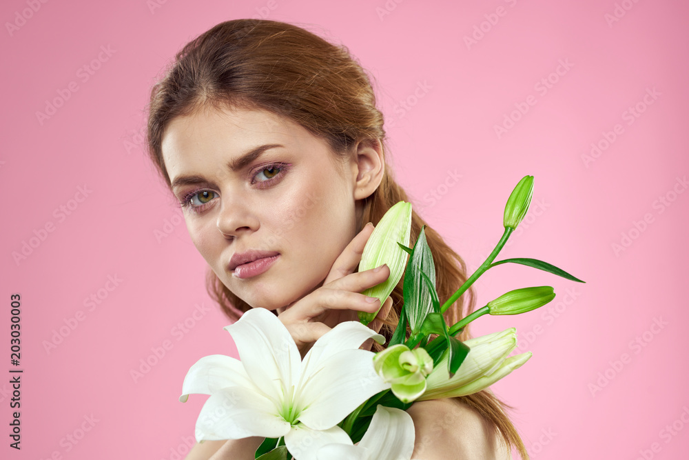 red-haired woman holding a flower in her hand red-haired woman holding a flower in her hand
