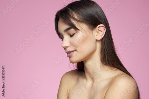 beautiful smile, brunette, pink background