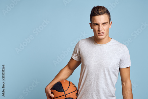 sports man holding ball in hand