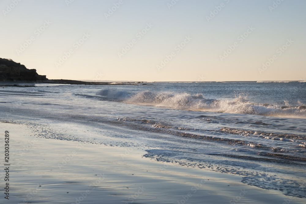 Sea waves on a beach ocean background in sunny day Sea waves on a beach ocean background in sunny day