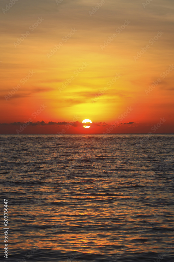An image of a nice red sunset with a big yellow sun