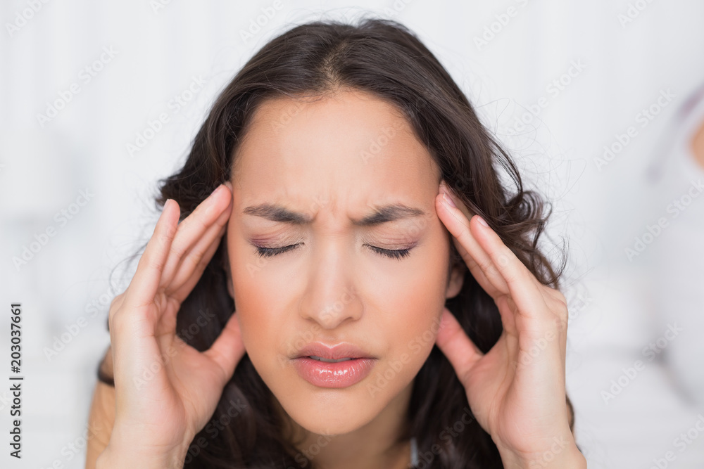 Beautiful woman suffering from headache with eyes closed Beautiful woman suffering from headache with eyes closed