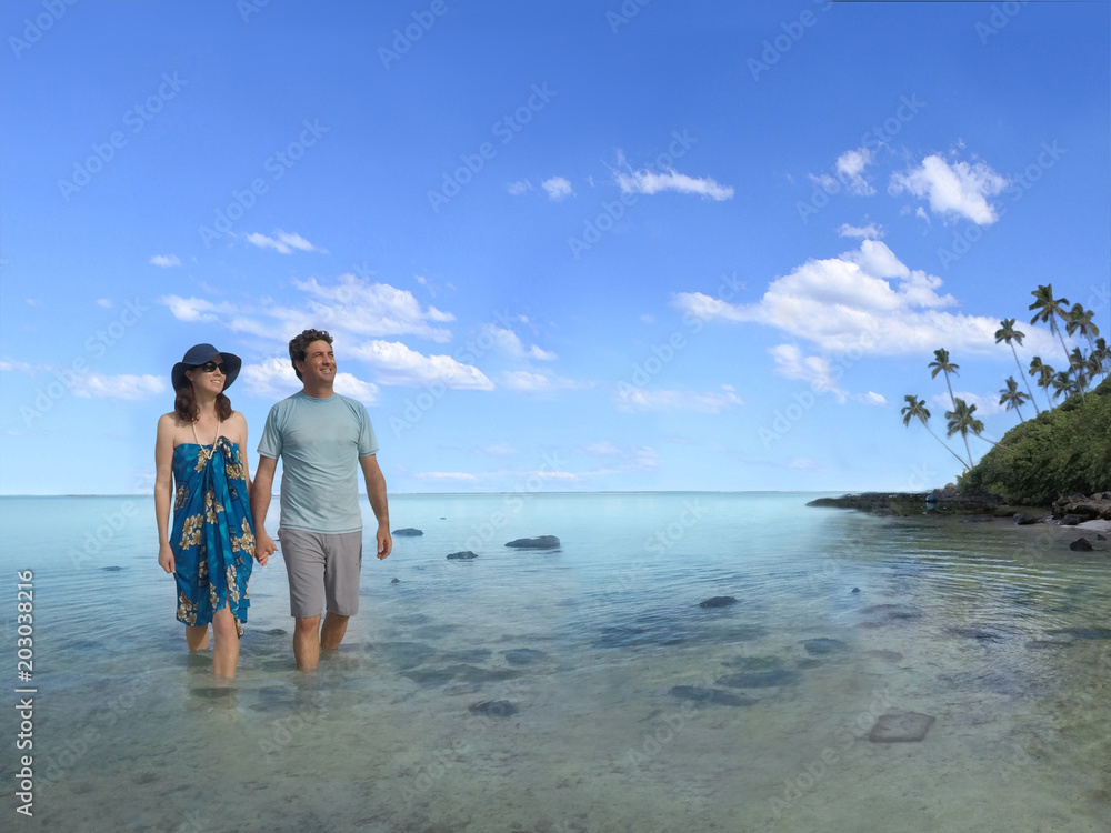 Honeymoon couple hold hands while exploring an islet in Muri  lagoon in Rarotonga Cook Islands