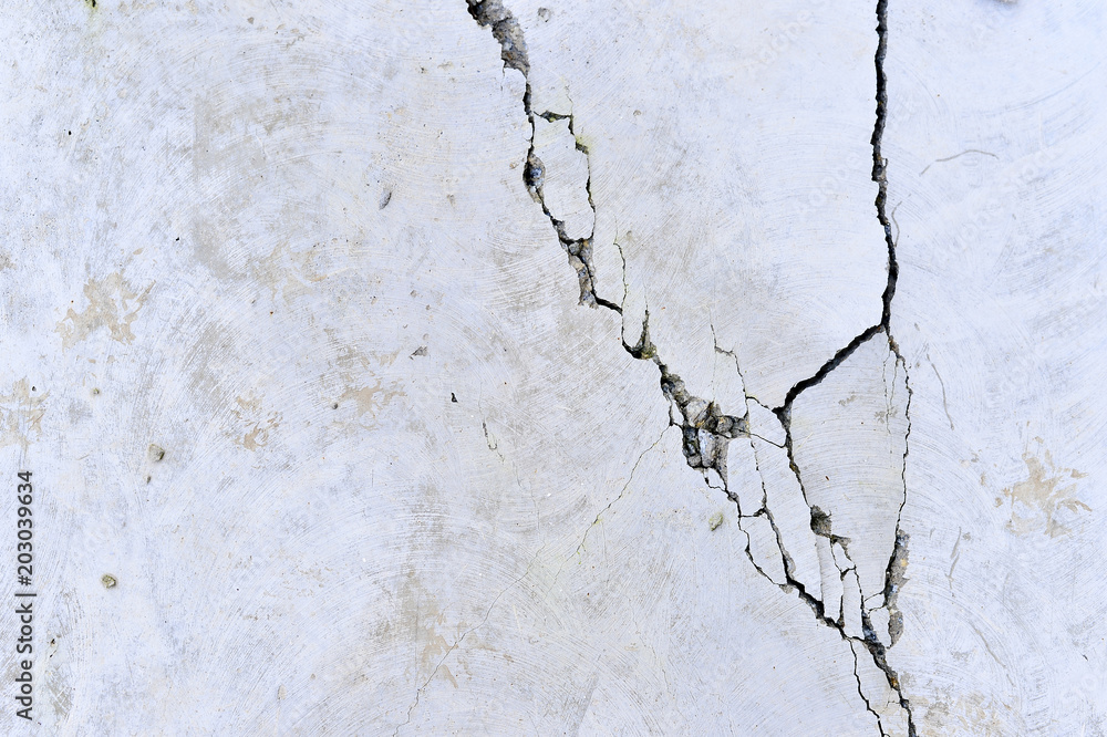 Naklejka premium Part of the concrete wall with a crack of the old building. Background.