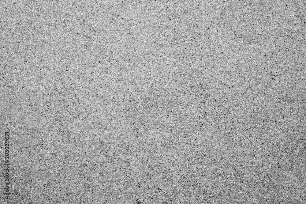 Textured smooth surface of sand. Background. Black and white image. Textured smooth surface of sand. Background. Black and white image.