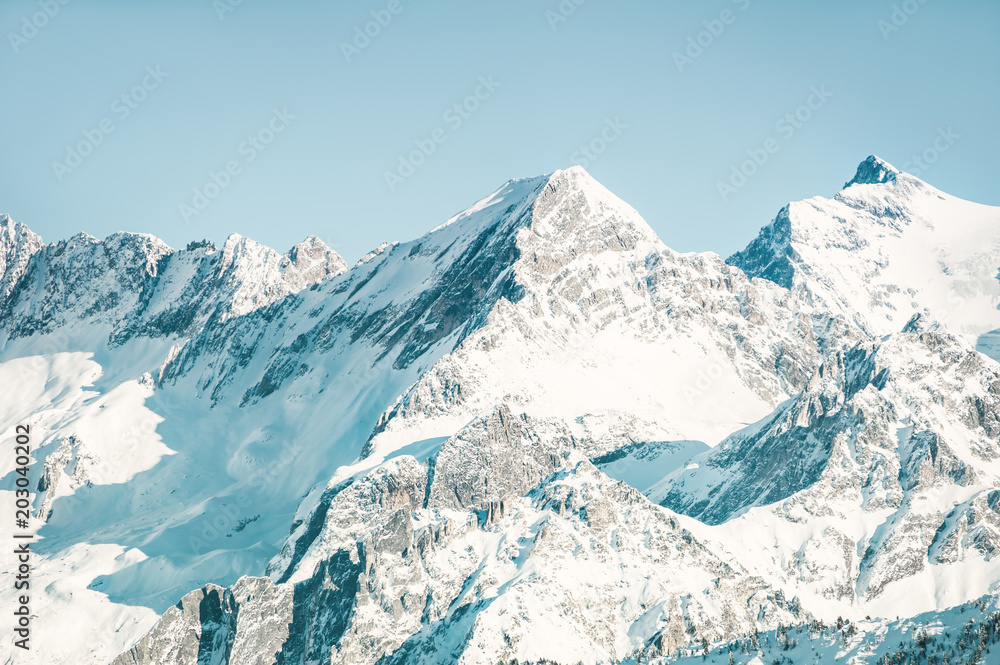 Snow-covered mountain peaks in winter. Alps mountains, France