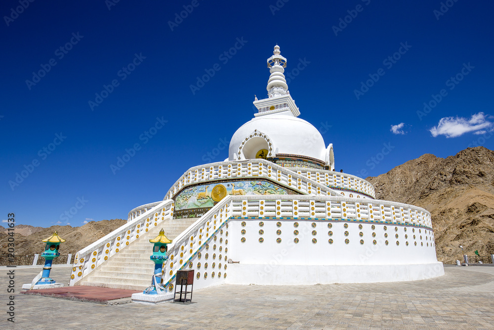 View of Tall Shanti stupa with blue sky, the big stupa in Leh and one from the best buddhist stupas in Jammu and Kashmir, Ladakh, India. White stupa in the Himalayan mountains