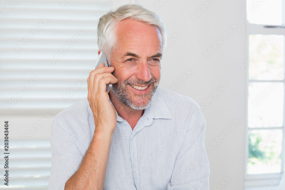 Mature man using mobile phone Mature man using mobile phone