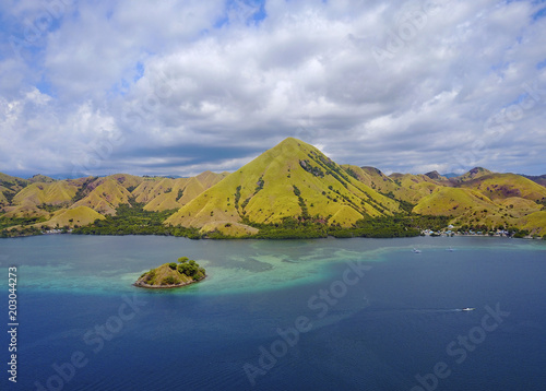 Beautiful aerial view of beaches and tourist boat sailing in Flores Island  Indonesia.