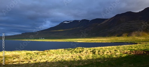 Icelandic landscape - the evening sun on lake Svinavatn, in the background the Svinadalsfjall photo