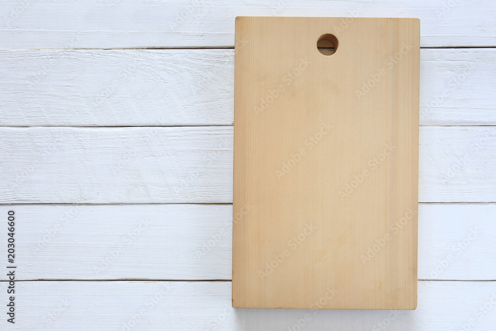 Chopping Wood placed on a white wooden floor and have copy space. Chopping Wood placed on a white wooden floor and have copy space.
