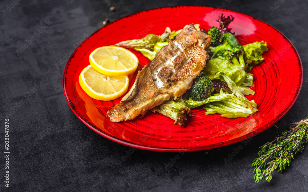 Steamed snapper (pacific ocean perch, sea bass, ruby perch) with soy sauce, lemon, ginger and parsley in Asian style. Healthy cooking Steamed snapper (pacific ocean perch, sea bass, ruby perch) with soy sauce, lemon, ginger and parsley in Asian style. Healthy cooking