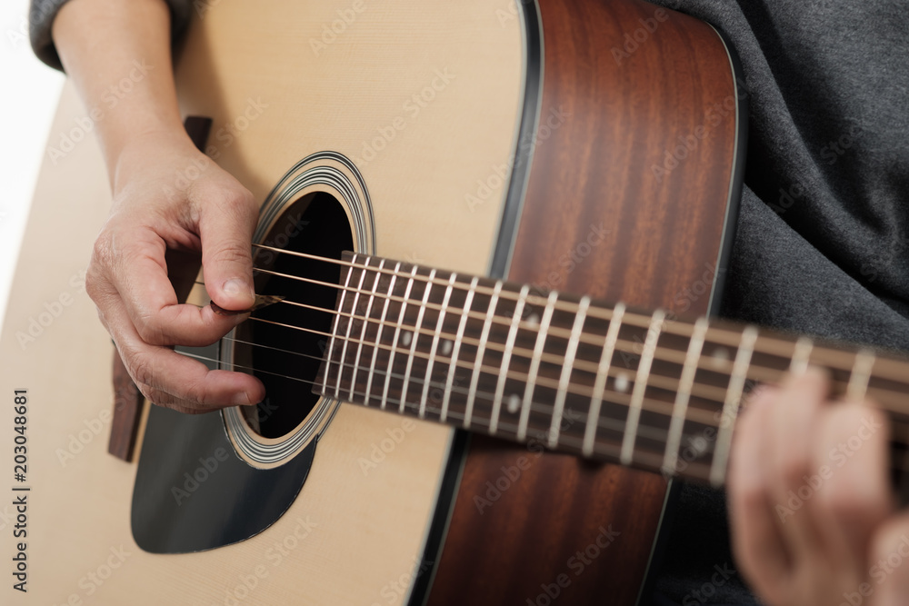 Obraz premium Woman's hands playing acoustic guitar.