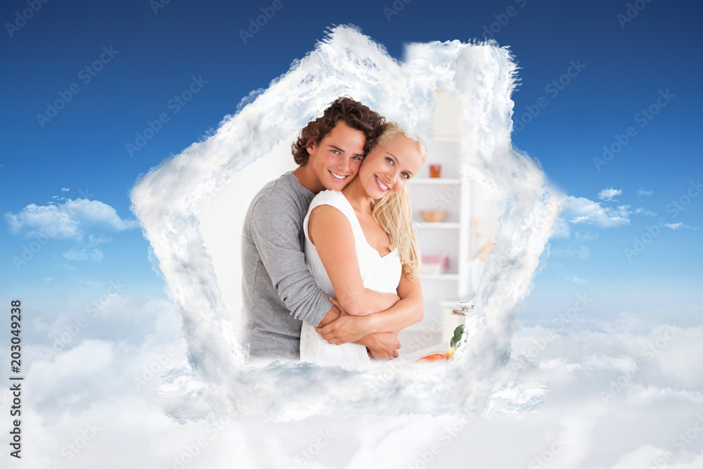 Young couple posing against bright blue sky over clouds Young couple posing against bright blue sky over clouds