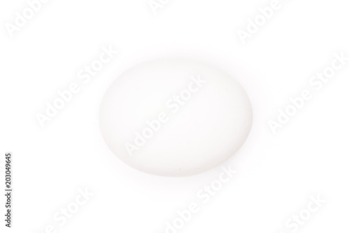One white chicken egg isolated on white background.