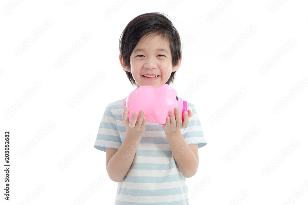 Asian child holding pink piggy bank on white background Asian child holding pink piggy bank on white background