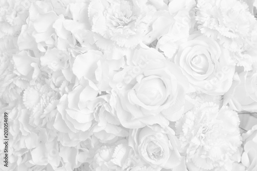 Beautiful decoration artificial rose flower in white tone background.