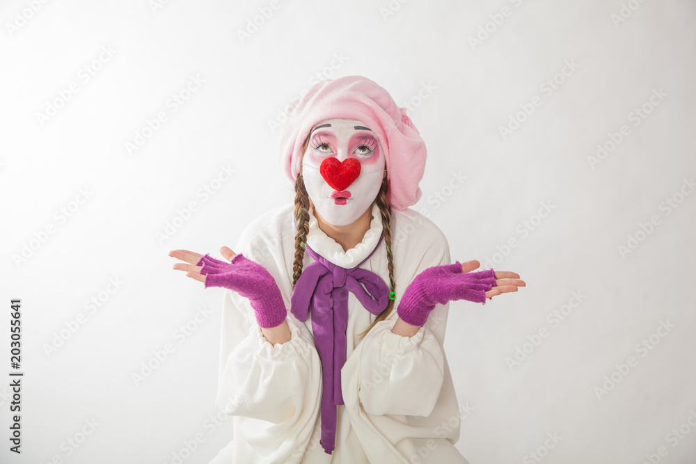 mime girl in a snowman costume. Man with emotions on a white background. mime girl in a snowman costume. Man with emotions on a white background.