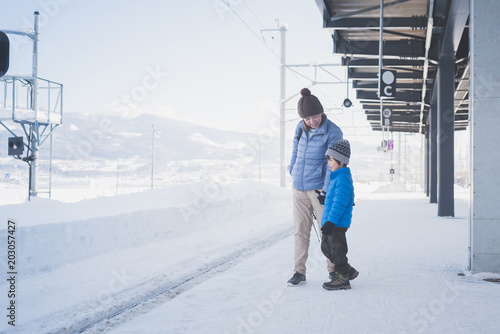 mother and son waiting express train