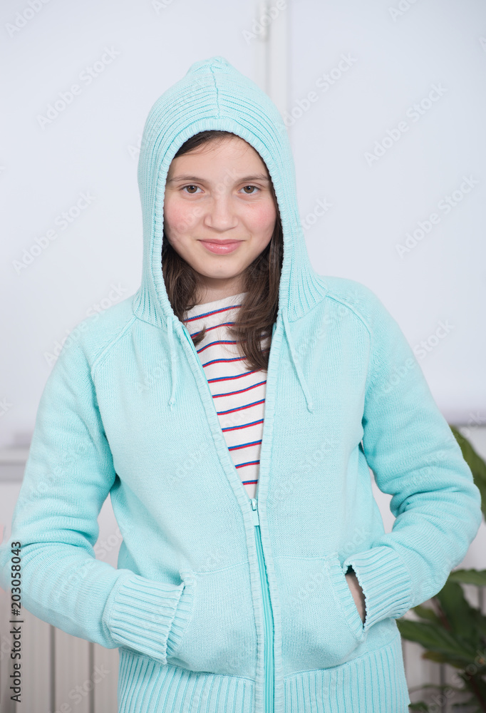 young girl with blue hood on her head young girl with blue hood on her head