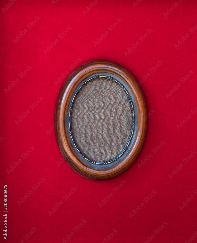 elegant victorian wooden frame on a red background elegant victorian wooden frame on a red background