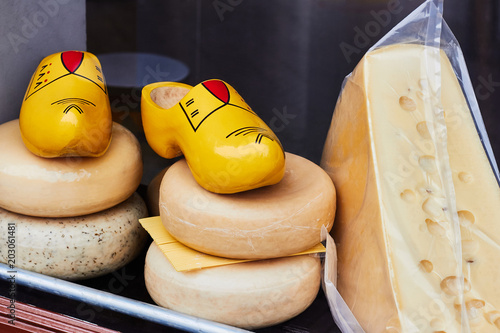 Photography Dutch cheese and traditional wooden shoes clogs in the shop window