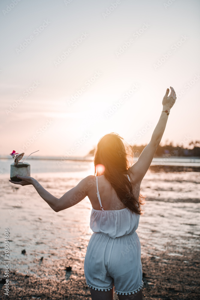 Woman with cocktail on beach Woman with cocktail on beach