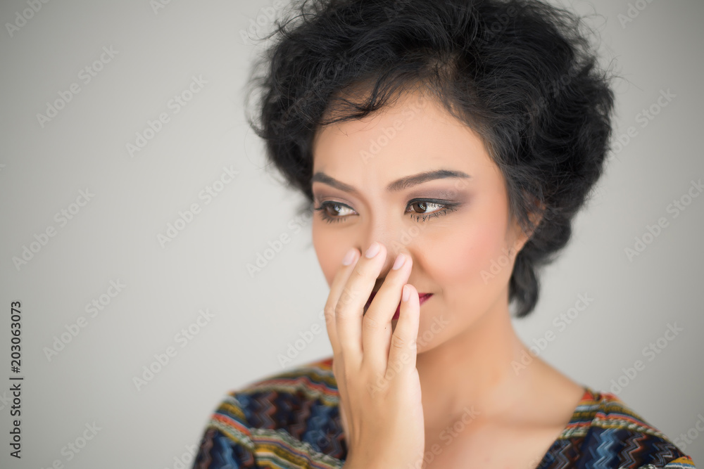 Young girl making silence gesture over isolated white background Young girl making silence gesture over isolated white background