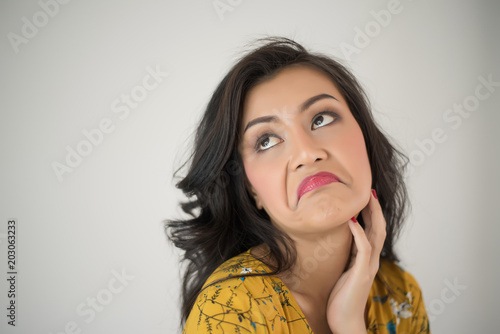 Young woman envy on  white background photo