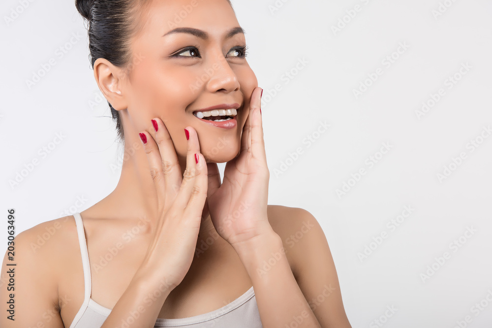 Beautiful Young Woman with Clean Fresh Skin touch own face Beautiful Young Woman with Clean Fresh Skin touch own face