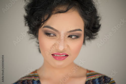 Fotografie Young woman envy on  white background