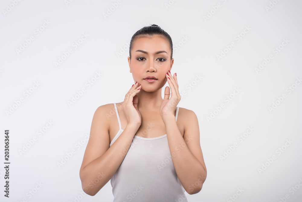 Beautiful Young Woman with Clean Fresh Skin touch own face Beautiful Young Woman with Clean Fresh Skin touch own face