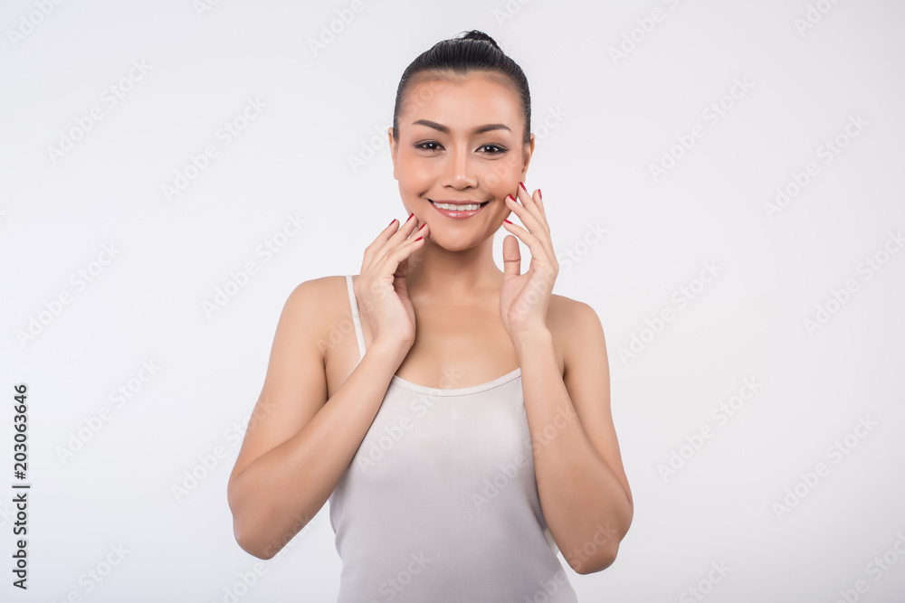 Beautiful Young Woman with Clean Fresh Skin touch own face Beautiful Young Woman with Clean Fresh Skin touch own face