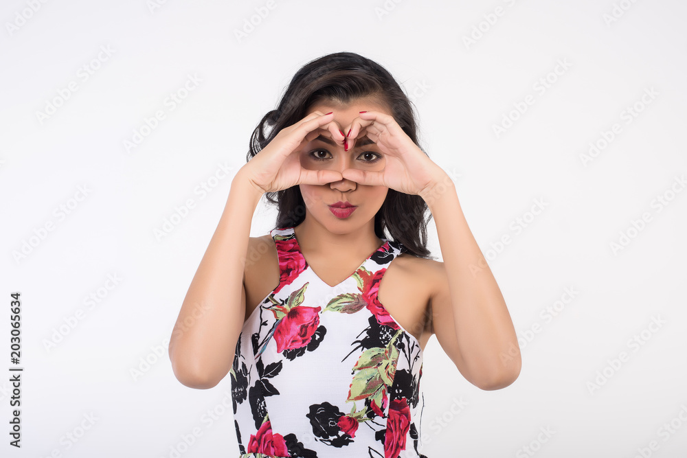 girl making binoculars hands on white background girl making binoculars hands on white background