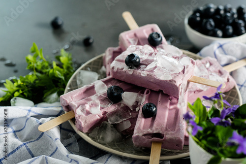 Blueberry popsicle ice cream on a dark background