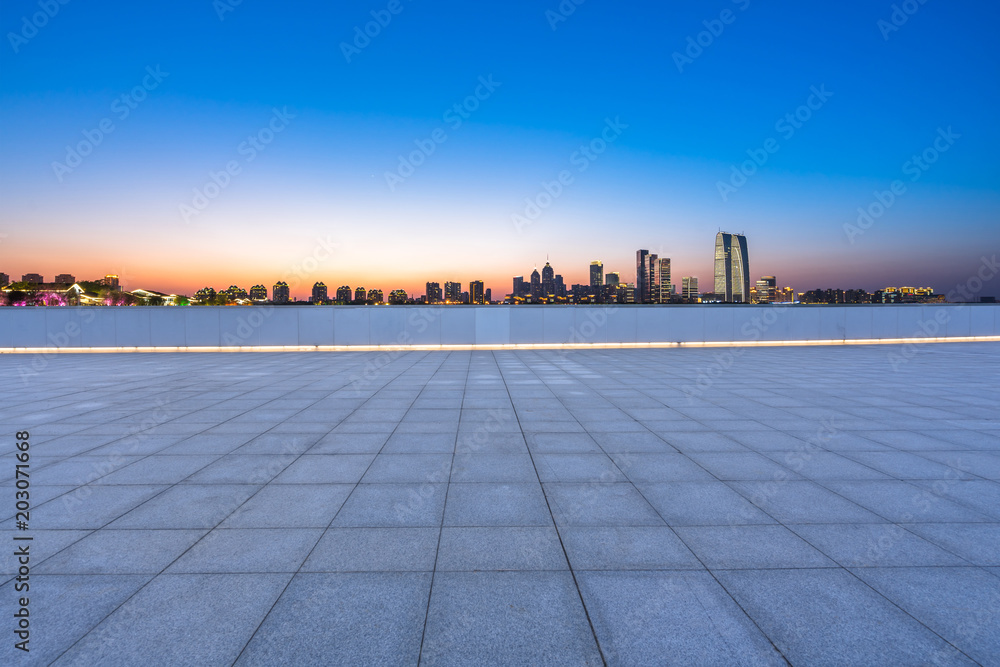 empty marble floor with city skyline