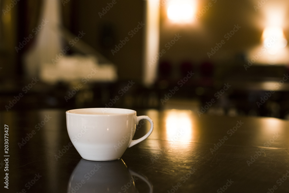 White cup is in the cafe on the table