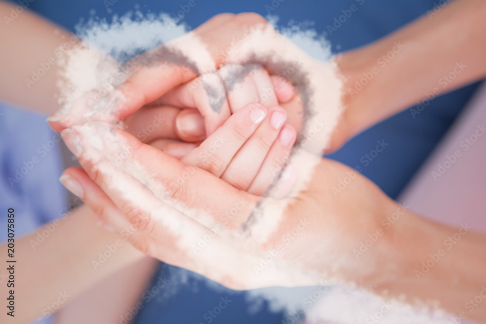 cloud heart against mother and daughter touching hands cloud heart against mother and daughter touching hands