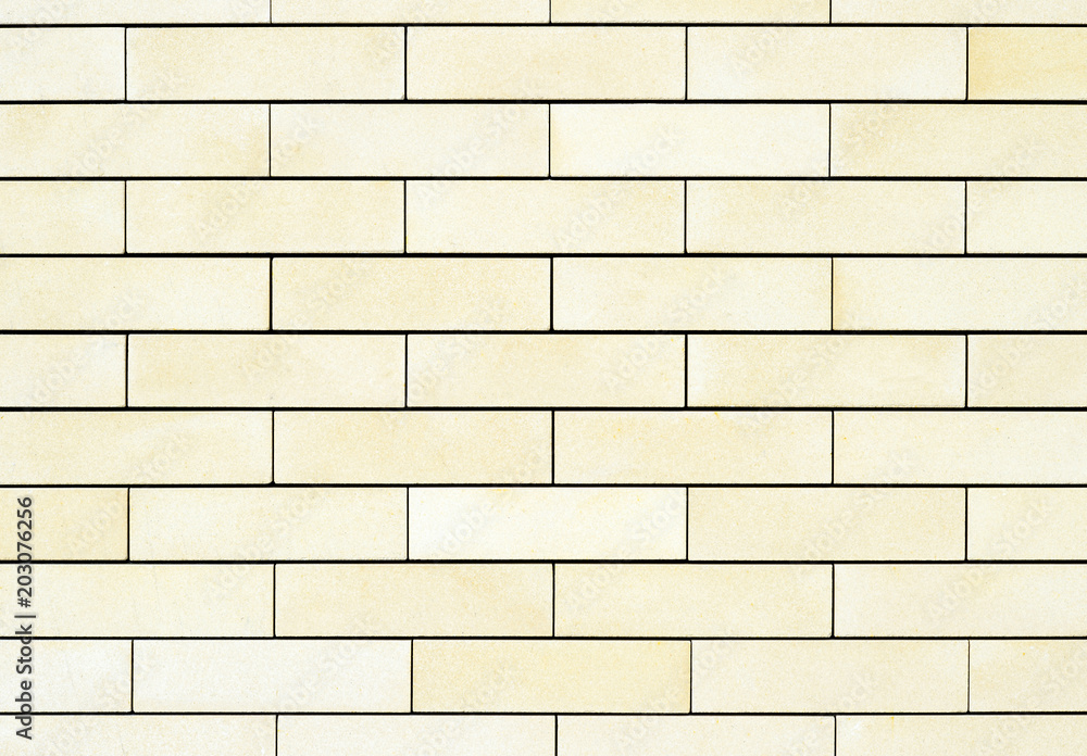 Obraz premium The average texture of the walls are light yellow bricks. Background.
