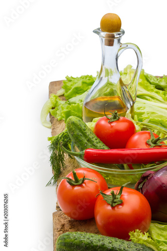 Set vegetable and jug of vegetable oil isolated on the white background